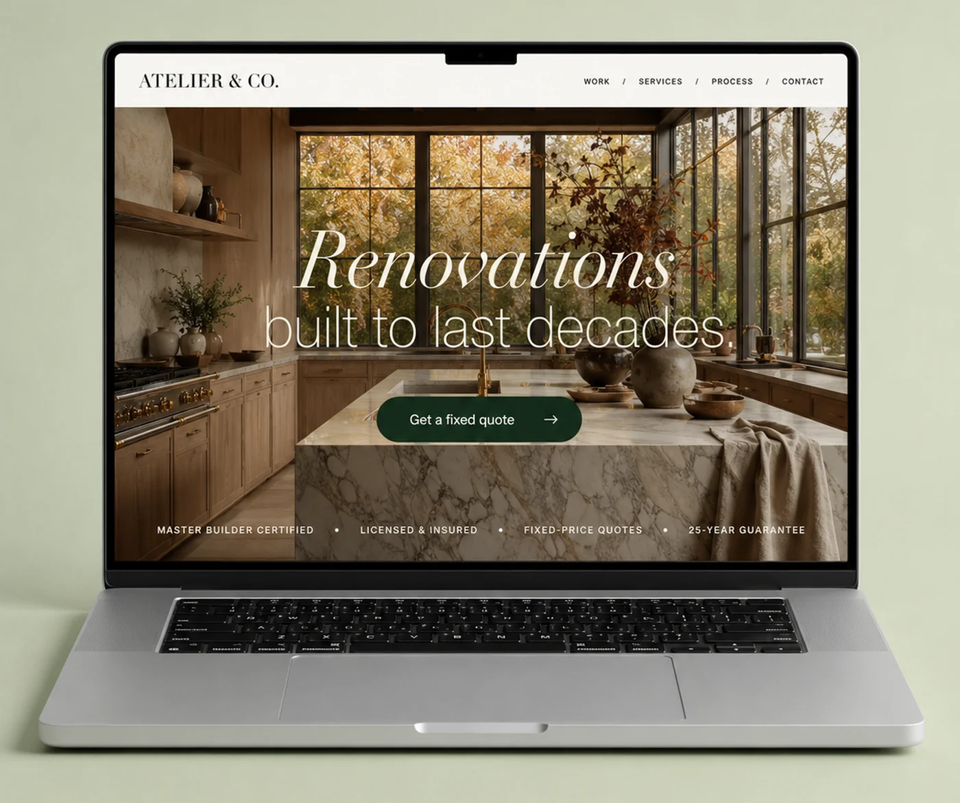 Atelier & Co. renovations website shown on a laptop